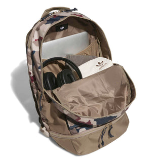 adidas Skateboarding FS+ Camo Backpack in Khaki Three/Khaki Six/Aurora Ink — 24.9L, recycled polyester, plain weave, zipper closure, bold camo design for skate and street