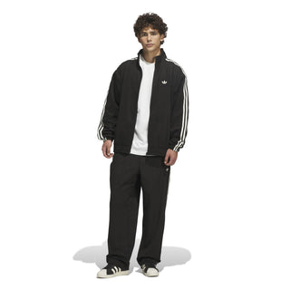 adidas Skateboarding Vintage Superfire Track Top in Black and Cream White with relaxed fit and full-zip design.