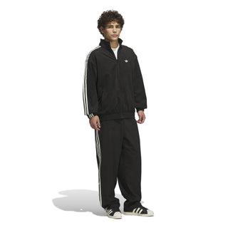 adidas Skateboarding Vintage Superfire Track Top in Black and Cream White with relaxed fit and full-zip design.
