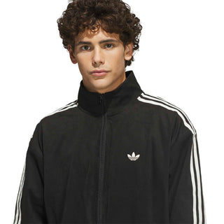 adidas Skateboarding Vintage Superfire Track Top in Black and Cream White with relaxed fit and full-zip design.