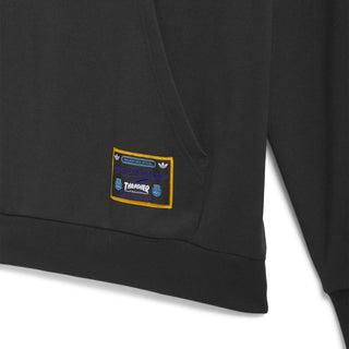 Black hoodie with a patch on the chest against a white background