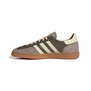 adidas Originals Handball Spezial in Earth Strata/Warm Vanilla — cracked leather quarter with suede overlays, soft gum rubber outsole, and iconic 3-Stripes in a warm, earthy colorway.

