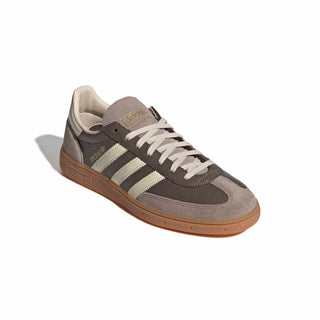 adidas Originals Handball Spezial in Earth Strata/Warm Vanilla — cracked leather quarter with suede overlays, soft gum rubber outsole, and iconic 3-Stripes in a warm, earthy colorway.

