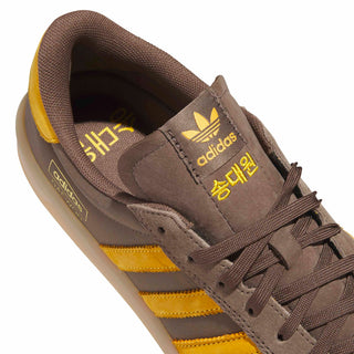 adidas Skateboarding Glenburn x Daewon Shoes in Earth Strata/Crew Yellow/Gum — leather and textile upper, rubber outsole with heel drop-in, lace closure, regular fit for skating and everyday wear