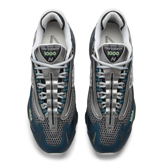 New Balance 1000 in Deep Ocean with Dark Silver Metallic accents and ABZORB cushioning.