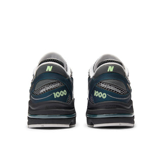 New Balance 1000 in Deep Ocean with Dark Silver Metallic accents and ABZORB cushioning.