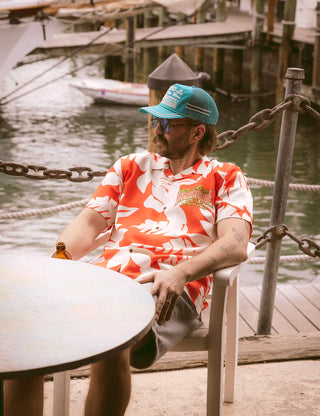 Duvin x Margaritaville Beach Club Buttonup short sleeve shirt in Red, relaxed fit classic camp collar with front chest pocket, 88% Tencel 12% Linen blend, lightweight breathable fabric made to be worn untucked, coastal lifestyle collaboration shirt