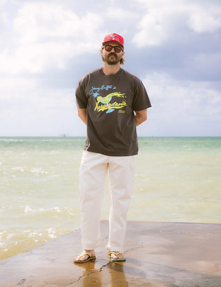 "Duvin x Margaritaville Please Return Tee in Black — relaxed fit beach lifestyle collab tee from Duvin Design Co."