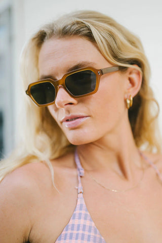 Otis Eyewear Metric sunglasses in Eco Milky Yellow with Neutral Grey mineral glass lenses, sleek square silhouette thin handmade eco acetate frame with distinctive wire core detail, Viscottica hinges, stainless steel screws, OTIS logo temple tip, 100% UVA UVB protection