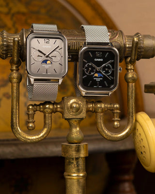 CASIO MTPM305MC-1AV analog watch with moon phase display, stainless steel mesh band, date and day dials, 50m water resistance, and classic design