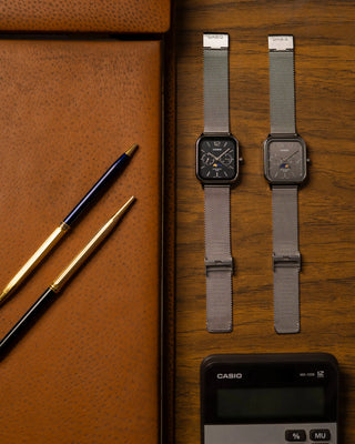 CASIO MTPM305MC-8AV analog watch with moon phase display, gold-tone stainless steel mesh band, date and day dials, 50m water resistance, and classic design