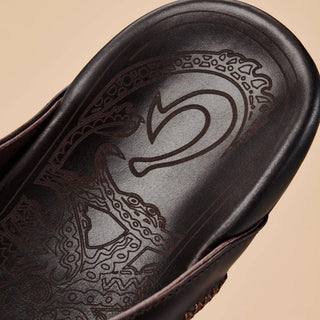 OluKai Mea Ola Leather Sandals in Dark Java/Dark Java — premium full-grain leather with canoe lash whipstitching, octopus laser-etched footbed, microfiber lining, and handsewn leather toe post