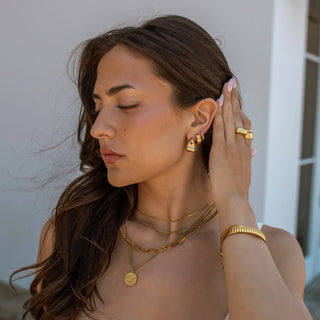 ALCO Sable hoops in 18K gold-plated stainless steel with push back hoop closure for classic everyday style.
