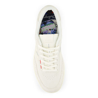 White sneaker with colorful interior on a white background