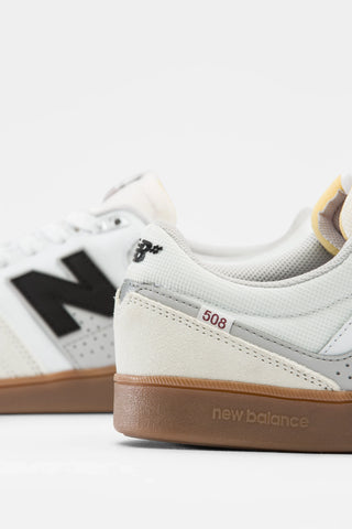 New Balance Numeric 508 in Sea Salt/Black with suede upper and reflective detailing.