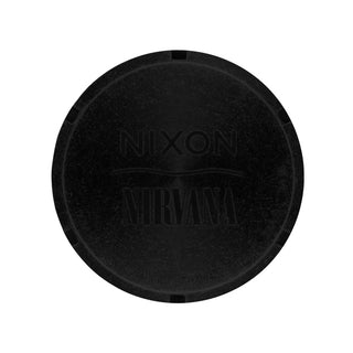 Black circular object with 'Nixon' and 'Nirvana' branding on a white background