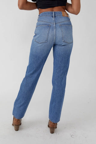 Free People high-rise straight leg jeans in rigid denim with five-pocket design.