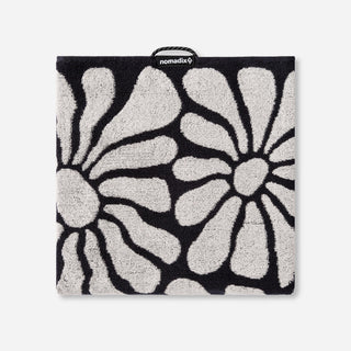 Nomadix Organic Cotton Beach Towel in Lazy Daisy Black — plush, absorbent, Fair Trade Certified™, 100% organic cotton, 30" x 72.5"