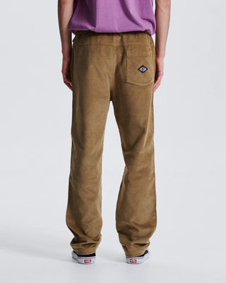 Critical Slide Fever Cord Pant in Camel with relaxed straight fit and elastic waist, made from heavy 8-wale corduroy.