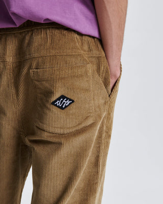 Critical Slide Fever Cord Pant in Camel with relaxed straight fit and elastic waist, made from heavy 8-wale corduroy.