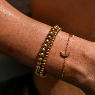 ALCO Seaside Stretch bracelet in 18K gold-plated stainless steel with comfortable stretch design for effortless coastal style.