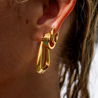 ALCO Sable hoops in 18K gold-plated stainless steel with push back hoop closure for classic everyday style.