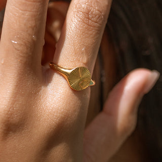 Elegant Sunburst Ring from ALCO Jewelry in 18K gold-plated stainless steel, hypoallergenic, and water-resistant.