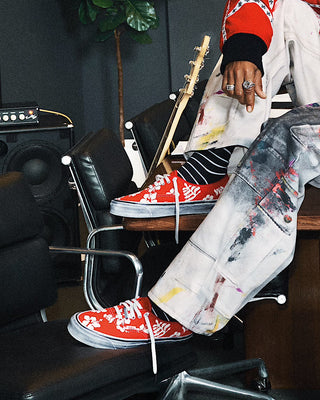 Vans LX Authentic 44 Archive Red sneaker with bright red canvas upper and classic low-top silhouette.
