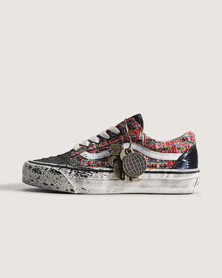 Vans LX Old Skool Charms Red Black sneaker with textured tweed upper, splatter design, and metal charm detail.