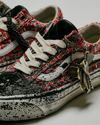 Vans LX Old Skool Charms Red Black sneaker with textured tweed upper, splatter design, and metal charm detail.