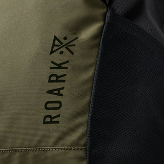 Roark Passenger 27L 2.0 Bag in Black/Military with roll-top closure, padded laptop sleeve, and waterproof zippers.