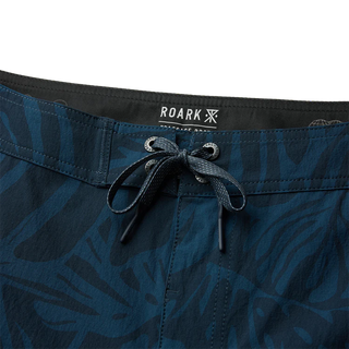 Roark Men's Passage Pro Boardshorts in Navy — durable nylon four-way stretch with 18.5" outseam, flat felled seams, and water-resistant finish for long days on the water.
