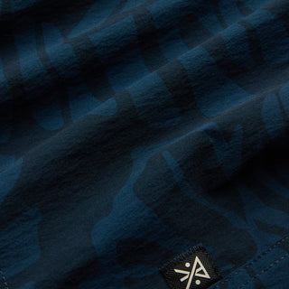 Roark Men's Passage Pro Boardshorts in Navy — durable nylon four-way stretch with 18.5" outseam, flat felled seams, and water-resistant finish for long days on the water.
