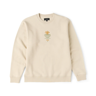 Roark Enjoy Globe Crew sweatshirt in Sand with a small centered flower-and-globe graphic, crew neckline, and ribbed cuffs and hem