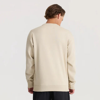 Roark Enjoy Globe Crew sweatshirt in Sand with a small centered flower-and-globe graphic, crew neckline, and ribbed cuffs and hem
