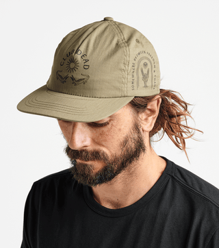 Roark Club Muerto 5-Panel Hat in Bronze featuring five-panel construction, adjustable strapback closure, and embroidered design.