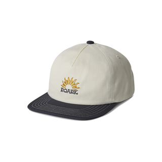 Roark Journey Snapback Hat in White/Black — structured 6-panel organic cotton canvas with curved visor and adjustable snapback closure