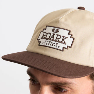 Roark Gaucho Venture Strapback Hat with classic five-panel unstructured design and adjustable strapback closure for a versatile fit.