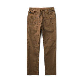 Roark's Layover 2.0 Relaxed Fit Pants, the perfect blend of style and comfort with features such as drawstring closure, oversized pockets, and a laser-perforated back for breathability.