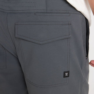 Roark Layover Pro Pants in Charcoal with stretch fit and ventilated back panel.