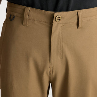 Roark Layover Pro Traveler Pants in Dark Khaki, straight-leg 4-way stretch Embarq Dura-Stretch fabric with TSA-friendly waistband, zippered travel pockets, back phone stash pocket, and laser-perforated cooling panel