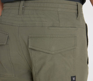 Roark Layover Pro Pants in Military green with stretch fabric and travel-ready features.