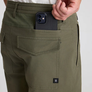 Roark Layover Pro Pants in Military green with stretch fabric and travel-ready features.