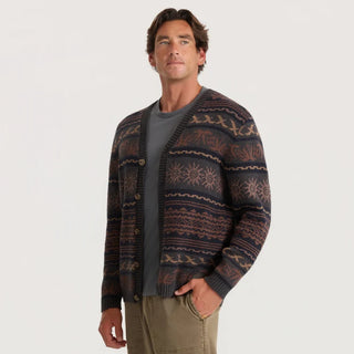 Roark Nomad Cardigan in Rust with horizontal geometric and sun motifs, a V-neck, button-front closure, and dark ribbed trim