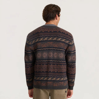 Roark Nomad Cardigan in Rust with horizontal geometric and sun motifs, a V-neck, button-front closure, and dark ribbed trim
