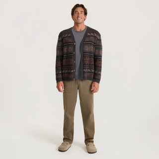 Roark Nomad Cardigan in Rust with horizontal geometric and sun motifs, a V-neck, button-front closure, and dark ribbed trim