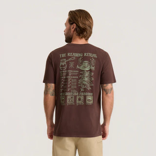 Roark Reading Ritual Premium Tee in Tobacco with a large cream-colored coffee-reading graphic featuring a coffee pot, cup, botanical illustration, and ritual instructions