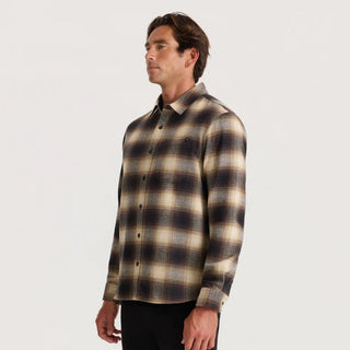 Roark Crossroads Organic Cotton Flannel in Faded Brown with a brown, cream, and grey plaid pattern, button-front closure, chest pocket, and long sleeves