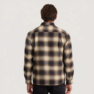 Roark Crossroads Organic Cotton Flannel in Faded Brown with a brown, cream, and grey plaid pattern, button-front closure, chest pocket, and long sleeves