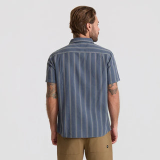 Roark Crosswinds Button Up Shirt in Neptune with blue-grey vertical dobby stripes, short sleeves, a button-front closure, and chest pocket